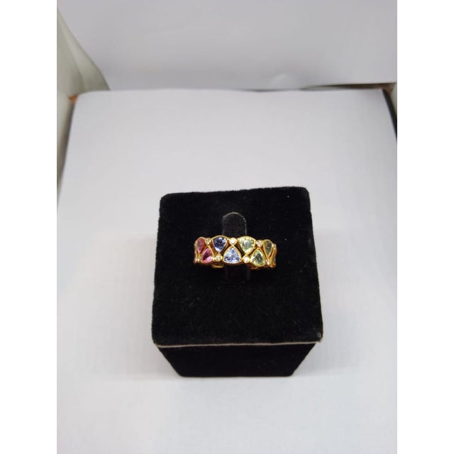 Gemstone details Gold Purity: 18K Solid Gold Diamond: 0.25 cts Multi sapphire: 5.77 cts 18K gold Net weight: 3.79 grams...