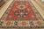 A tribal Caucasian Kazak rug hand-knotted with fine wool on a cotton foundation. This area rug features geometric...