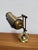Design Plus Gallery presents a Brass Bankers Lamp from the Art Deco/Mid-Century Era. The brass metal lamp has a top...