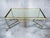 Beautiful elegant large coffee or side table, brass and acrylic glass legs with a glass table top. Italian production from...