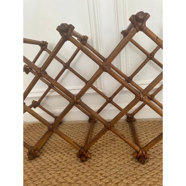 Beautiful rattan wine holder. Criss cross design with leather wraps. Burnt bamboo markings.