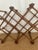 Beautiful rattan wine holder. Criss cross design with leather wraps. Burnt bamboo markings.