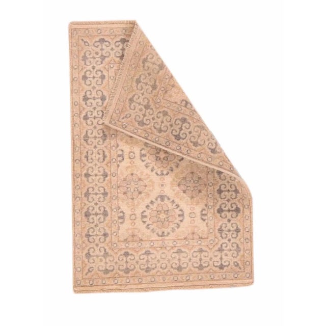 The sand field shows a section of an infinite repeat, here with three open medallions with eight lobe petal centres, and a...