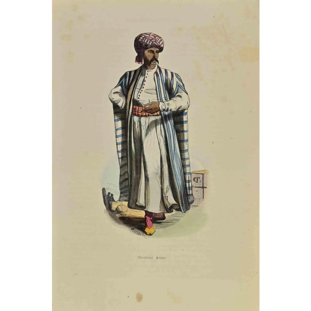 Arab Merchant is a lithograph made by Auguste Wahlen in 1844. Hand colored. Good condition. At the center of the artwork...