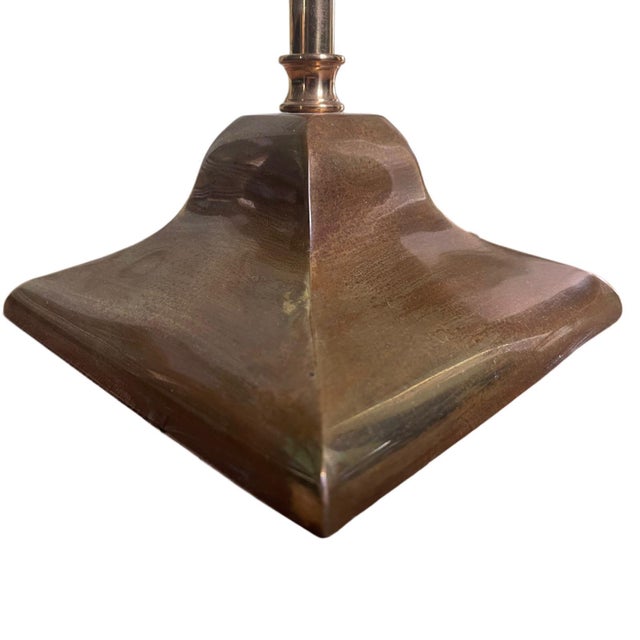 A refined adjustable floor lamp by David Iatesta crafted in unlacquered brass that will develop a natural, living patina...