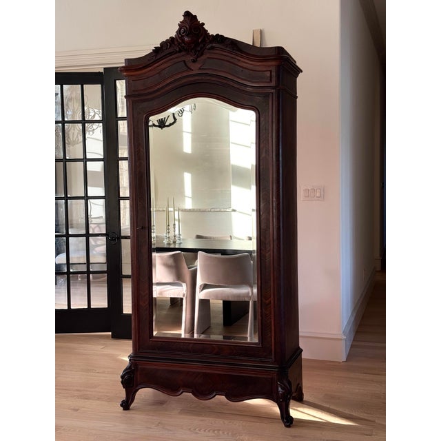 An exceptional 19th century French armoire vitrine, beautifully crafted in richly toned walnut and featuring an elegant...