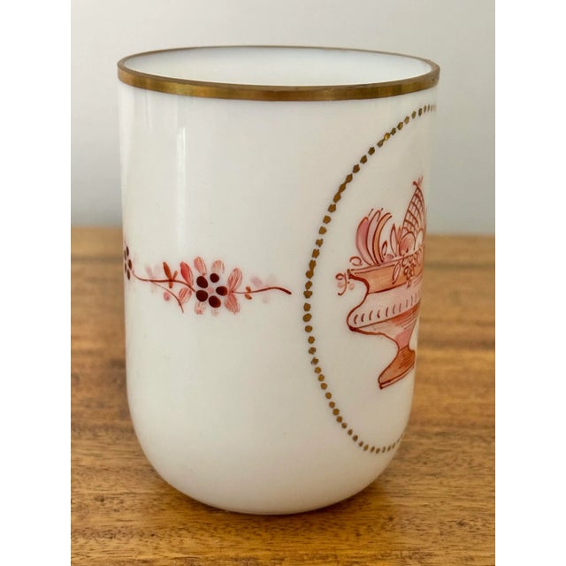 Rare fine semi-opaque white glass cup with a fruit bowl motif. Beautifully painted with light pink and orange with gold...