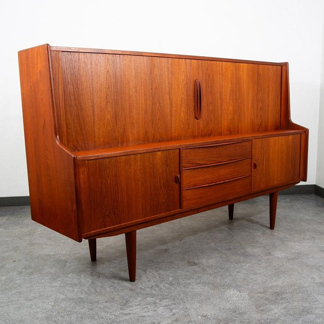 Beautiful tambour door credenza with anything you would need in a cabinet. drawers, storage and adjustable shelves and...