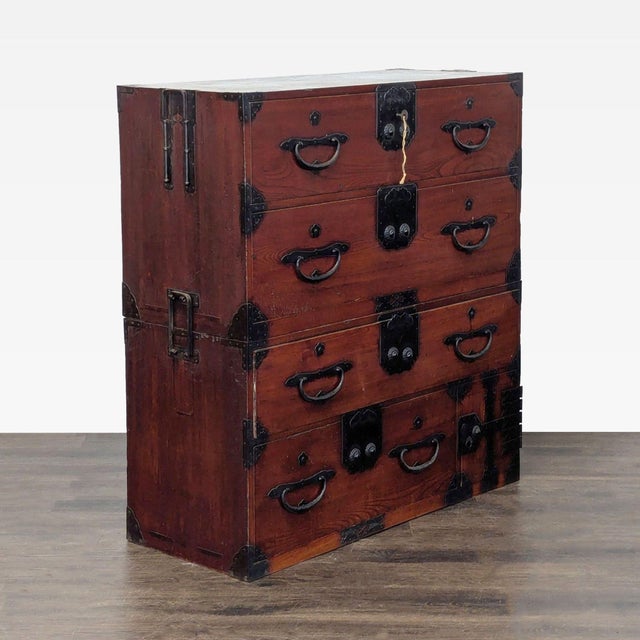 This unique dresser features a classic Japanese Nihonmatsu/Tansu style with natural wood and striking black iron hardware....