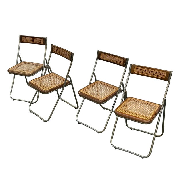 Set of 4 folding chairs that are the perfect mix of industrial and garden party! An interesting contrast between cane and...