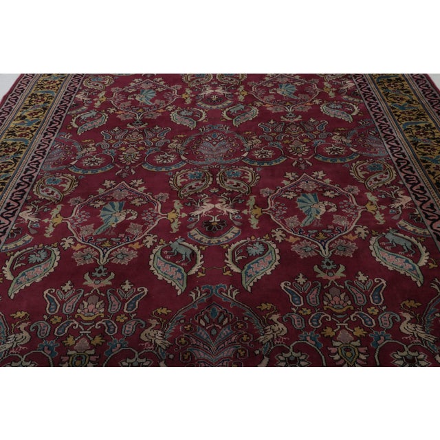 Hand-knotted in wool, an antique 9x16 Indian rug circa 1920-1930 - curated by Rug & Kilim. On the Design: This is a very...