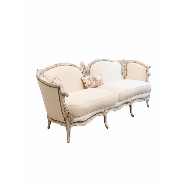 Antique Louis XV–Style Carved Sofa / Settee An exquisite Louis XV–style sofa featuring a hand-carved, distressed wood...