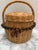 Vintage wood woven decor or storage basket with top handle and lid closure along with two strands of rustic large Tagua...