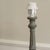 Table lamp base in grey-green with neoclassical ornamentation — columnar shaft, acanthus leaf baluster, square base with...
