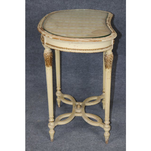 A particularly charming and unusual French Louis XVI-style lady’s vanity or dressing table, distinguished by its...