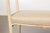 A small French walnut bench from circa 1920 with delicately carved motifs and upholstered seat. Embrace the charm of 1920s...