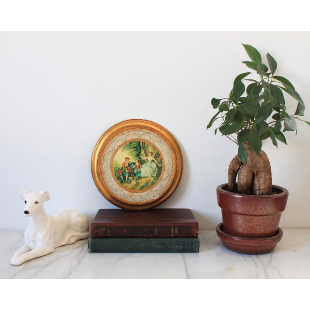 Vintage Italian Florentine round print of Nicolas Lancret's "L'Innocence. Makers mark on backside. Some age wear to gilded...