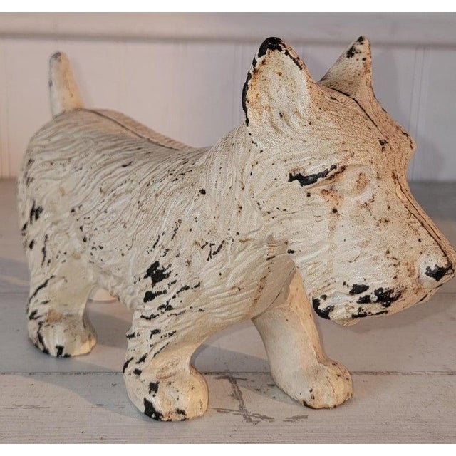 This is a Hubley original cream painted cast iron dog doorstop .The condition is very good.