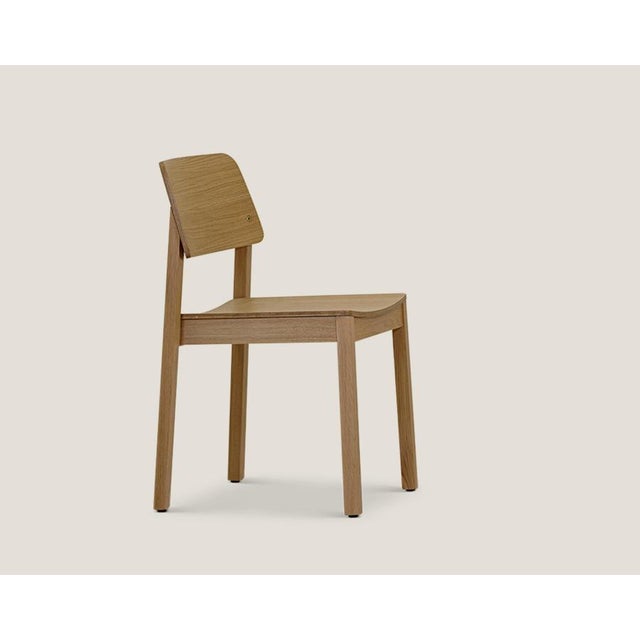 Friis and moltke mio chair for on collection. the mio chair is a classic yet contemporary stackable chair with a low...