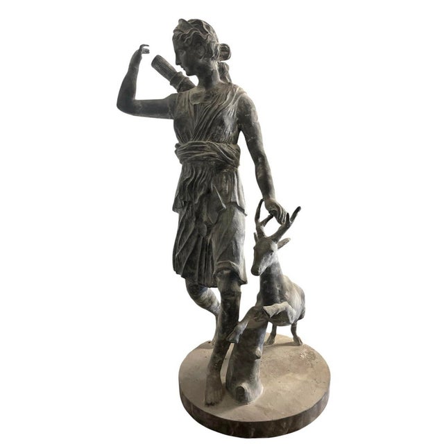 This impressive, full-scale classical cast iron garden statue depicts Diana the Huntress (the Greek goddess Artemis),...