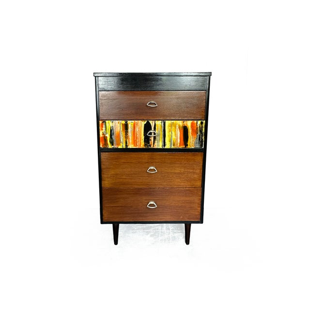 Absolutely stunning 1950's tallboy/chest of drawers. Four drawers, with brass pullers sit squarely on four atomic legs,...