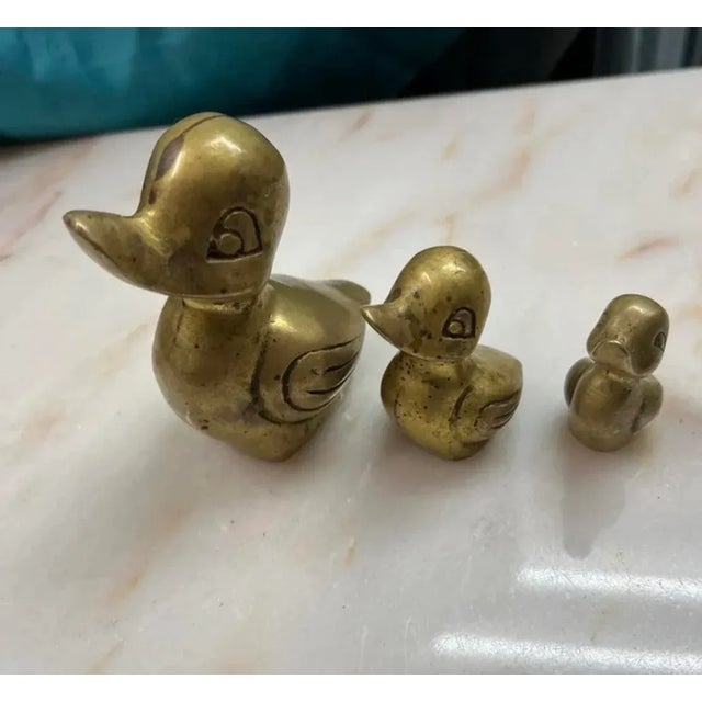 Solid brass duck family. Momma duck with 2 ducklings graduating in size. Momma is 3.5” tall Next is 2.25” tall Smallest is...