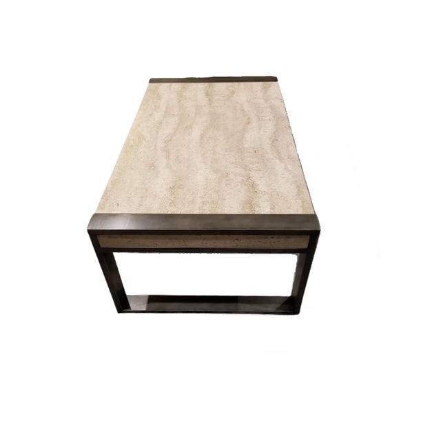 Elevate your living space with this stunning modern travertine coffee table featuring a natural stone top and sculptural...