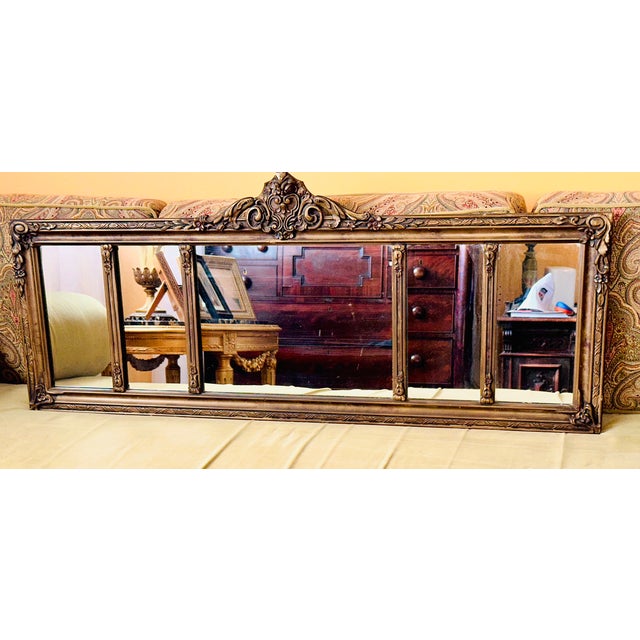 Antique style 5 panel mirror!A muted gold color frame with embellishments on the sides and top.Approximately 48" wide x...