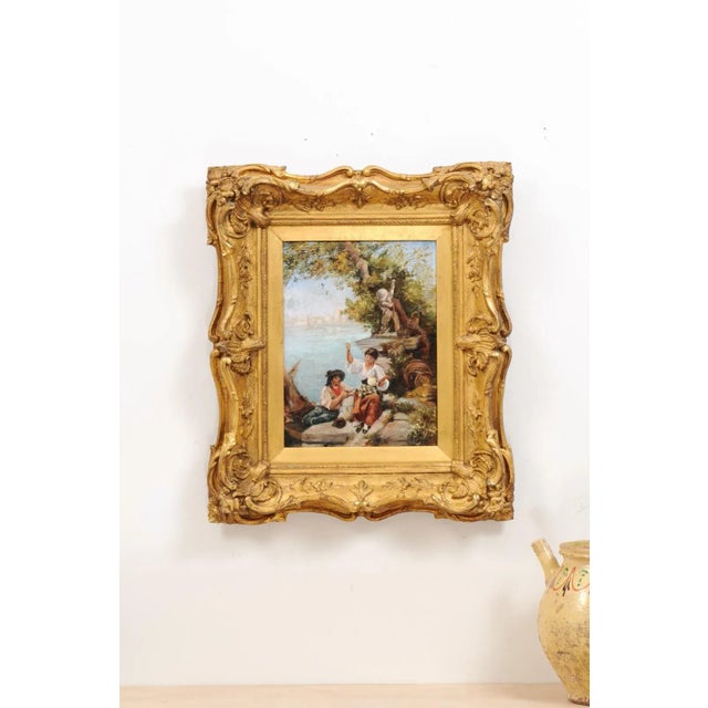A French 19th century Continental School painting in carved giltwood frame, depicting a scene set in the Venetian lagoon....