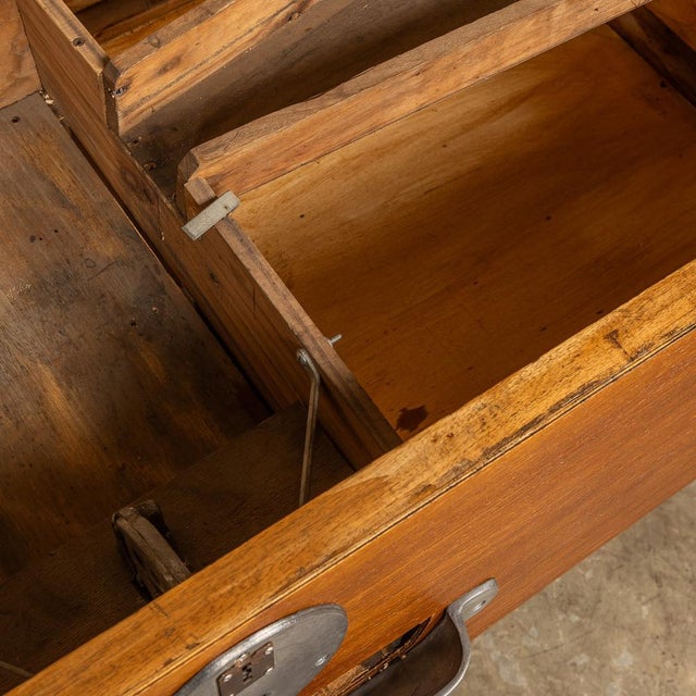 This mid-20th-century foosball table, with its captivating two-tone color scheme of black legs and a hardwood body,...