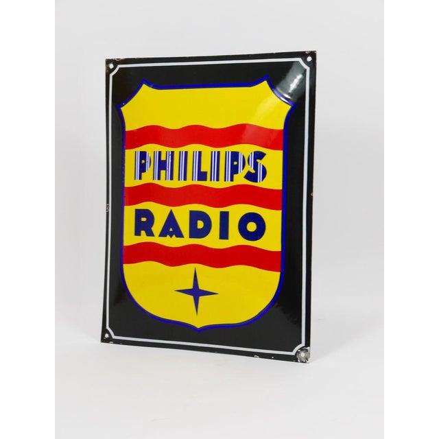 An enameled advertising sign / wall plaque "Philips Radio", dating from around 1930. It was produced for the Dutch brand...