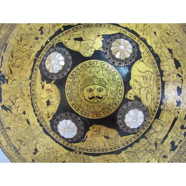 Incredible Rajput dhal shield crafted in North India, most likely early 20th century. Made of hardened hide lacquered in...