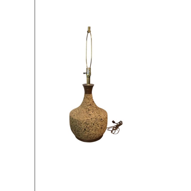 Charming pair of vintage cork table lamps featuring sculptural bottle-form silhouettes with warm organic texture and rich...