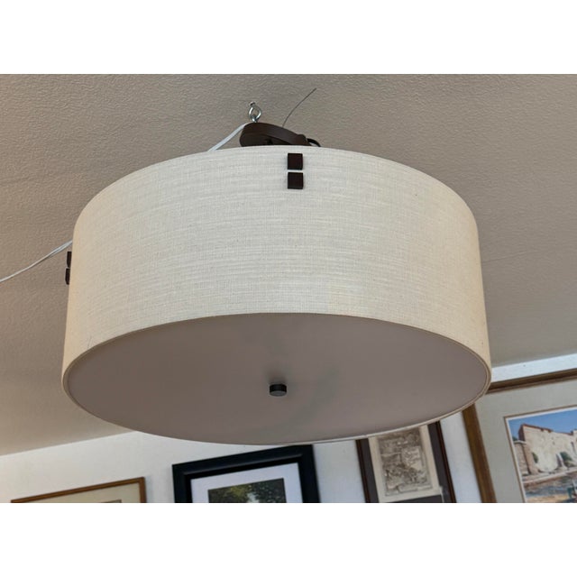 Design Plus Gallery presents the Finials Drum Pendant from the Textile Collection from Justice Design Group. A circular...