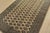 A tribal Bokhara rug hand-knotted with fine wool on a cotton foundation. This rug features rows of repeating medallions...