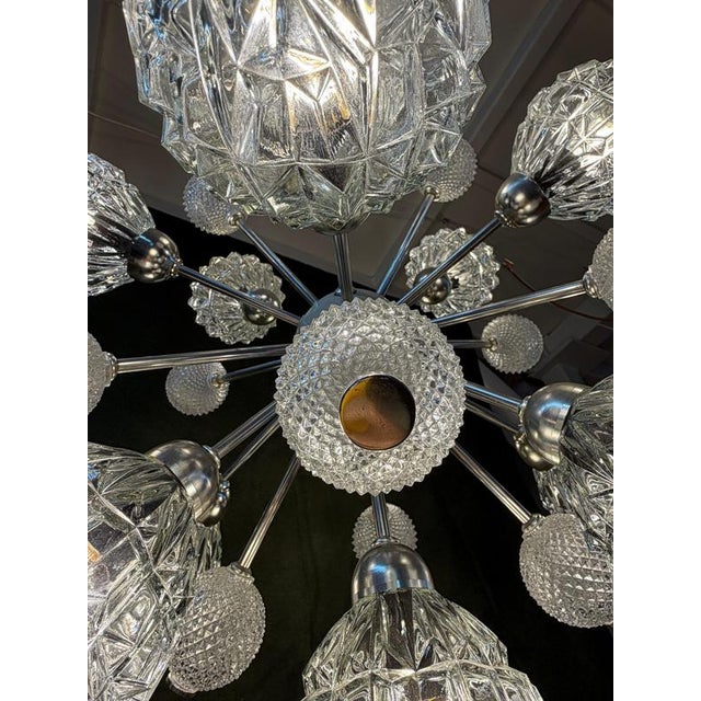 An opulent statement piece: this sputnik chandelier from the 1970s, made by the hungarian manufacturer elektrofém isz,...