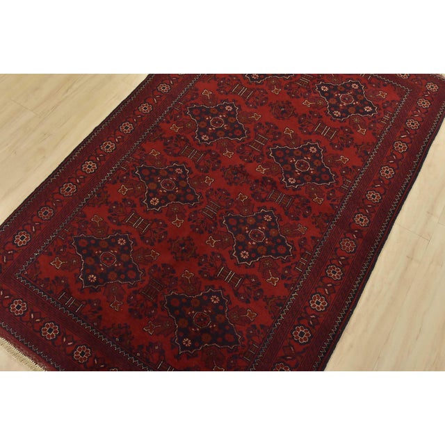 A tribal Turkmen rug hand-knotted with fine wool on a cotton foundation. This rug features medallions surrounded by...