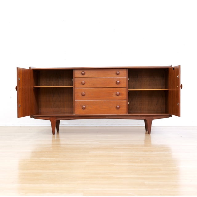 This vintage mid-century credenza by John Herbert for A. Younger is a wonderful minimalist design and excellent storage...