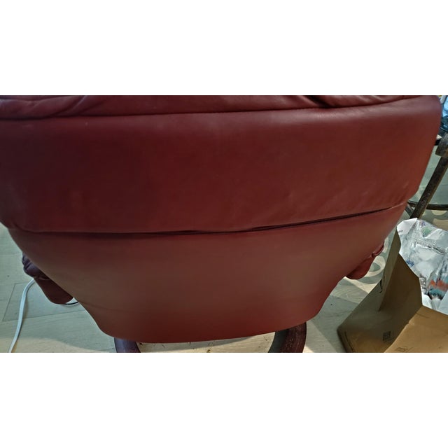 This is the highly desirable size Large Ekornes recliner, beautifully upholstered in a rich, sophisticated burgundy...
