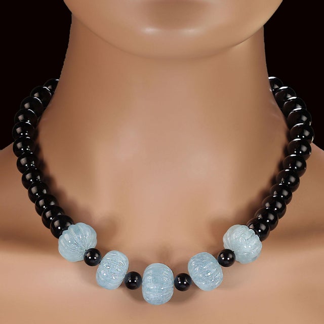 This striking 19‑inch necklace showcases the timeless beauty of highly polished 12mm black onyx beads, arranged to create...