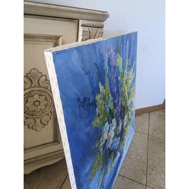 “July Bouquet” is an original oil painting on canvas by Ukrainian artist Ivanna Hamuliak, created in 2021. Size: 31.49 ×...