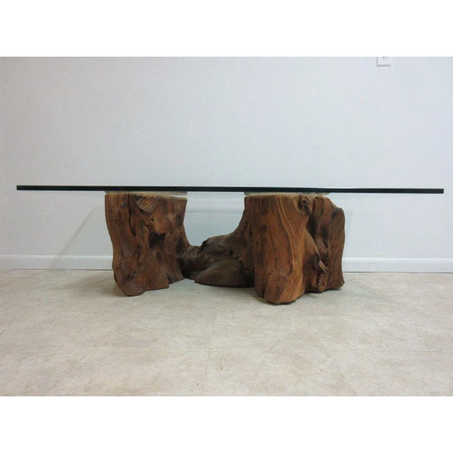 A Mid-Century free form live edge log coffee table. Measurements ( l x w x h)60 x 30.25 X 18 great shape. Minor scratches...