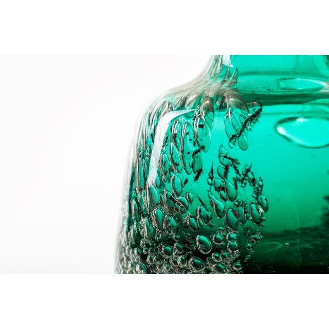 Bubble glass pitcher is a beautiful original emerald green glass decorative object: Made in Austria circa 1950s of 20th...