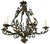 This is an early 20th century French iron six arm chandelier with cascading leaves and roses. It has six arms and the...