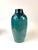 Tall Green-blue vase with an iridescent sheen.