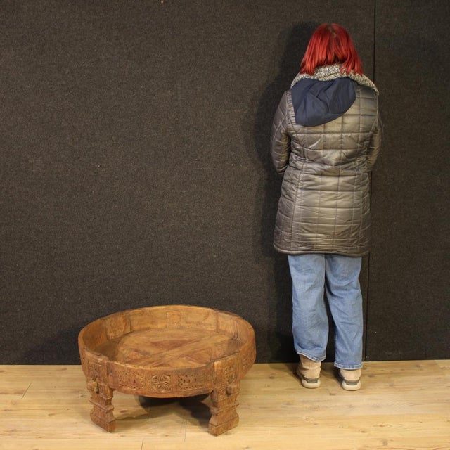 Indian coffee table from the first half of the 20th century. Richly carved and chiseled in exotic wood, this attractive...