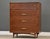 A mid century modern walnut tall dovetail drawer dresser with four drawers made by Kent Coffey The Sceptre. Circa 1960’s....