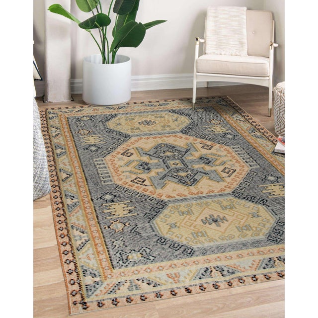 A handwoven wool kilim, made in India and measuring 8' x 10'. Kilims carry no pile — the pattern is woven through the...