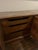 Authentic Henredon credenza featuring a rich walnut finish, ornate circular detailing, and a stunning original marble top....