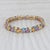 Gemstone Information: - Natural Tanzanites, Blue Topaz, Amethysts, Peridots, Citrines, Grape Garnet - Total Carats -...